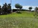 Well-maintained backyard with grassy lawn and mature trees at 3260 Casa Del Rey Ave, Kissimmee, FL 34746
