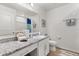 Well-lit bathroom with a granite countertop vanity, ample storage, and modern fixtures, offering comfort and style at 3260 Casa Del Rey Ave, Kissimmee, FL 34746