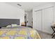 Cozy bedroom featuring sliding closet doors and soft carpeting, offering comfort and convenience at 3260 Casa Del Rey Ave, Kissimmee, FL 34746