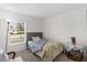 Bright bedroom with a view from the large window, neutral carpet, and an inviting decor, creating a relaxing atmosphere at 3260 Casa Del Rey Ave, Kissimmee, FL 34746