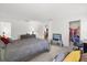 Spacious bedroom with soft carpeting, work space, closet and ample sunlight, offering comfort and convenience at 3260 Casa Del Rey Ave, Kissimmee, FL 34746