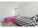 A cozy bedroom features two beds, a window, and neutral walls at 3260 Casa Del Rey Ave, Kissimmee, FL 34746