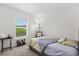 Bright bedroom with a large window, neutral carpet, and inviting decor, creating a relaxing atmosphere at 3260 Casa Del Rey Ave, Kissimmee, FL 34746
