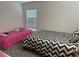 Shared room with two beds, carpet, and lots of natural light at 3260 Casa Del Rey Ave, Kissimmee, FL 34746