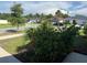 Street view highlighting the lush front yard with mature plantings and well-maintained landscaping at 3260 Casa Del Rey Ave, Kissimmee, FL 34746