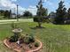 Landscaped front yard featuring a bird bath and meticulous planting beds at 3260 Casa Del Rey Ave, Kissimmee, FL 34746