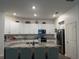 Modern kitchen featuring granite countertops, stainless steel appliances, and a center island at 3260 Casa Del Rey Ave, Kissimmee, FL 34746
