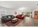 Bright and open living room with hardwood floors and sliding glass doors to the backyard at 3260 Casa Del Rey Ave, Kissimmee, FL 34746