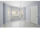 Dining room featuring large windows, neutral walls, and tile flooring offers a versatile space at 33234 Kaylee Way, Leesburg, FL 34788