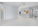 Bright living room with an open floor plan that connects the living room, kitchen and entryway at 33234 Kaylee Way, Leesburg, FL 34788