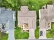 Aerial view of the home's roof and backyard showcasing well-maintained landscaping and outdoor spaces at 3460 Idlewood Loop, The Villages, FL 32162