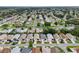 Panoramic aerial shot showcasing the community's neatly arranged streets, homes and lush landscaping at 3460 Idlewood Loop, The Villages, FL 32162