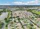 Beautiful aerial shot of the neighborhood nestled near a lake at 3460 Idlewood Loop, The Villages, FL 32162