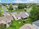 Expansive aerial view of the community showcasing well-maintained homes and lush landscaping at 3460 Idlewood Loop, The Villages, FL 32162