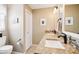 Bathroom showcasing a double vanity with granite countertops, modern fixtures, and ample lighting at 3460 Idlewood Loop, The Villages, FL 32162