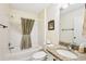 Bathroom featuring a granite countertop vanity and shower with a colorful curtain at 3460 Idlewood Loop, The Villages, FL 32162