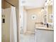Bathroom featuring a shower and double vanity with stone countertops at 3460 Idlewood Loop, The Villages, FL 32162