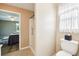 Bright bathroom featuring a tiled shower and toilet at 3460 Idlewood Loop, The Villages, FL 32162