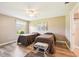 Cozy bedroom featuring twin beds, a ceiling fan, and neutral tones for a serene atmosphere at 3460 Idlewood Loop, The Villages, FL 32162
