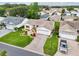 Charming home with a well manicured lawn, decorative driveway, and beautiful landscaping at 3460 Idlewood Loop, The Villages, FL 32162
