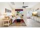 Comfortable living room with tile flooring, neutral decor, and plenty of natural light from the window at 3460 Idlewood Loop, The Villages, FL 32162