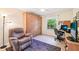 Home office features a Murphy bed and a large window overlooking the lawn at 3460 Idlewood Loop, The Villages, FL 32162