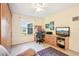 Office with large desk and ample lighting from overhead fixture and window at 3460 Idlewood Loop, The Villages, FL 32162