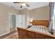 Bedroom featuring a comfortable bed, ample closet space, and access to another room at 3604 Corsica Ln, Clermont, FL 34711