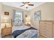 Comfortable bedroom with floral bedding, warm lighting, and matching bedside tables at 3604 Corsica Ln, Clermont, FL 34711