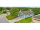 Inviting home with a two-car garage, brick-paved driveway, and well-maintained lawn at 3604 Corsica Ln, Clermont, FL 34711