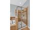 Close up view of walk-in shower with bench and glass door at 3604 Corsica Ln, Clermont, FL 34711