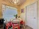 Charming breakfast nook featuring a round table with seating for four and a window with natural light at 3716 Eversholt St, Clermont, FL 34711