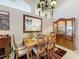 Elegant dining room with classic furniture and a decorative mirror, perfect for Gathering gatherings at 3716 Eversholt St, Clermont, FL 34711