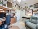 Organized home office with desk, chair, and diploma display, ideal for productivity and comfort at 3716 Eversholt St, Clermont, FL 34711