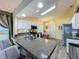 Modern kitchen with granite countertops, stainless steel appliances, and a breakfast bar at 3716 Eversholt St, Clermont, FL 34711