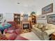 Comfortable living room showcasing a fireplace flanked by wooden bookshelves, and cozy furnishings at 3716 Eversholt St, Clermont, FL 34711
