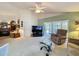 Spacious living room with comfortable furnishings, leading to a sliding glass door and outdoor space at 3716 Eversholt St, Clermont, FL 34711