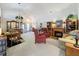 Spacious living room with dining area, fireplace, and comfortable seating, great for entertaining at 3716 Eversholt St, Clermont, FL 34711