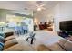 Open-concept living area with breakfast bar, neutral color palette, and inviting seating arrangement at 3716 Eversholt St, Clermont, FL 34711