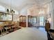 Open living space with dining area, vaulted ceilings, and natural light from windows and front door at 3716 Eversholt St, Clermont, FL 34711