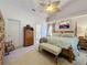 Serene main bedroom with traditional furnishings, a ceiling fan, and ample closet space at 3716 Eversholt St, Clermont, FL 34711