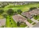 An aerial view displays the well-maintained landscaping and proximity to the golf course at 4210 Arlington Ridge Blvd, Leesburg, FL 34748