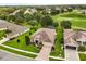 Beautiful home with well-manicured lawn and landscaping, and a golf course view at 4210 Arlington Ridge Blvd, Leesburg, FL 34748