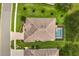 Aerial view showcasing the home, pool, and landscaped yard at 4210 Arlington Ridge Blvd, Leesburg, FL 34748