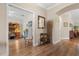 Inviting foyer with hardwood floors and arched doorway to other rooms of the house at 4210 Arlington Ridge Blvd, Leesburg, FL 34748