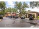 Various golf carts parked outside the clubhouse are ready for a day on the course at 4210 Arlington Ridge Blvd, Leesburg, FL 34748