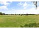 Scenic golf course with manicured greens and players enjoying a sunny day on the green at 4210 Arlington Ridge Blvd, Leesburg, FL 34748