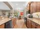Open kitchen featuring granite countertops, stainless steel appliances, and a breakfast nook at 4210 Arlington Ridge Blvd, Leesburg, FL 34748