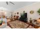 Spacious living room with hardwood floors, a decorative rug, and ample seating at 4210 Arlington Ridge Blvd, Leesburg, FL 34748