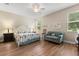 Bright main bedroom featuring a ceiling fan, and plenty of natural light at 4210 Arlington Ridge Blvd, Leesburg, FL 34748
